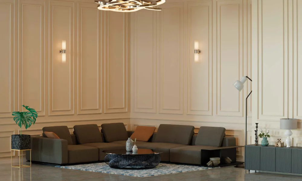 4 BHK living room at Raheja Marques with panelled walls and a sculptural chandelier